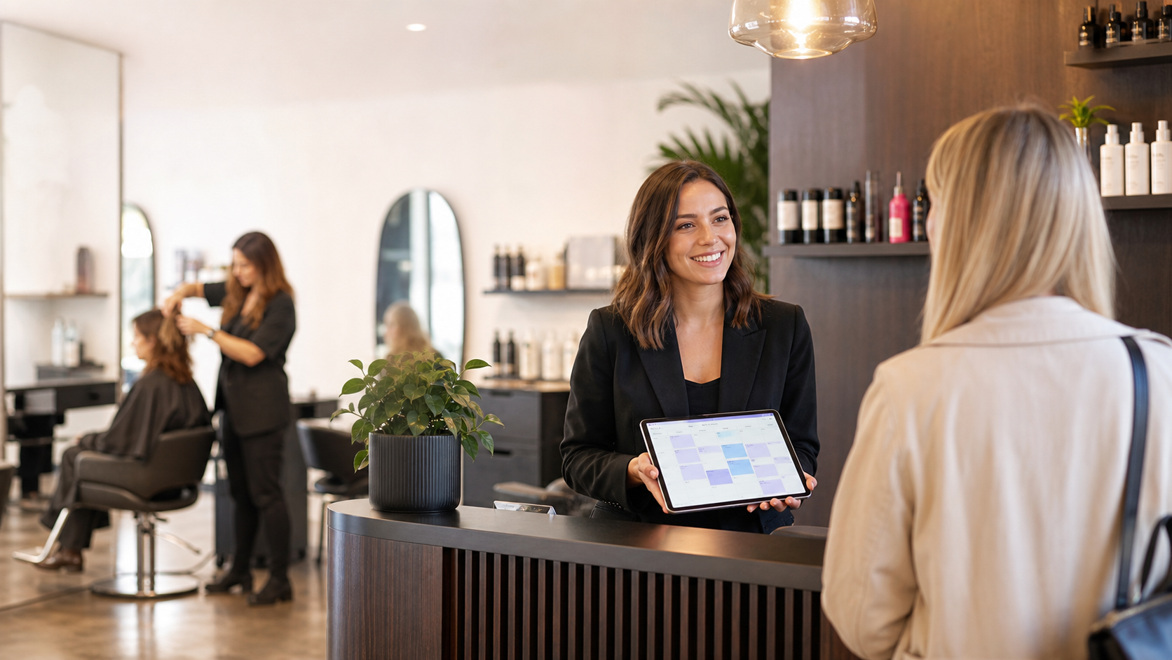 online booking system salons uk shown on a reception tablet